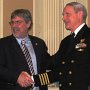 Rescued merchantman skipper R. Phillips (left) with Council board member retired SEAL Capt. D. Bisset after Phillips' speech to the Council on his recue by SEALs.