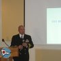 Former Chuchill skipper, CDR Juan Orosco, making 2011 presentation on the ship's recent deployment .